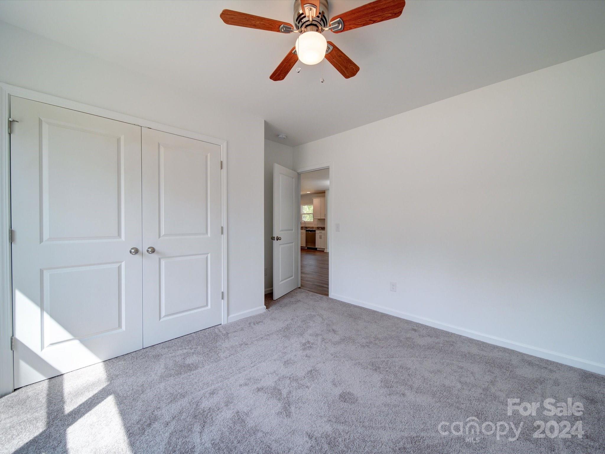 147 Lambeth Road Thomasville, NC 27360 - Photo 23 of 33 a view of an empty room and chandelier fan