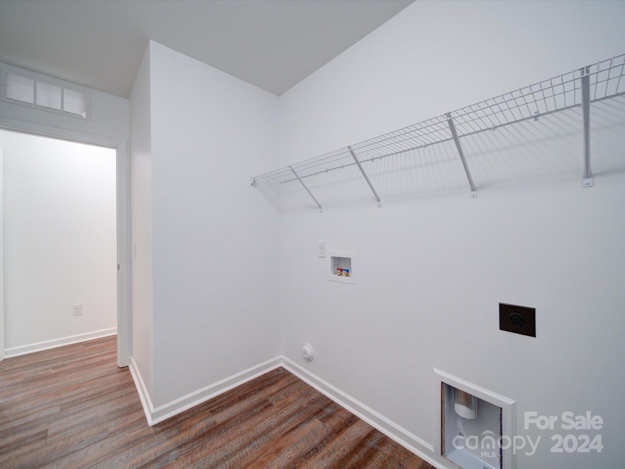 147 Lambeth Road Thomasville, NC 27360 - Photo 27 of 33 a view of a storage & utility room with wooden floor