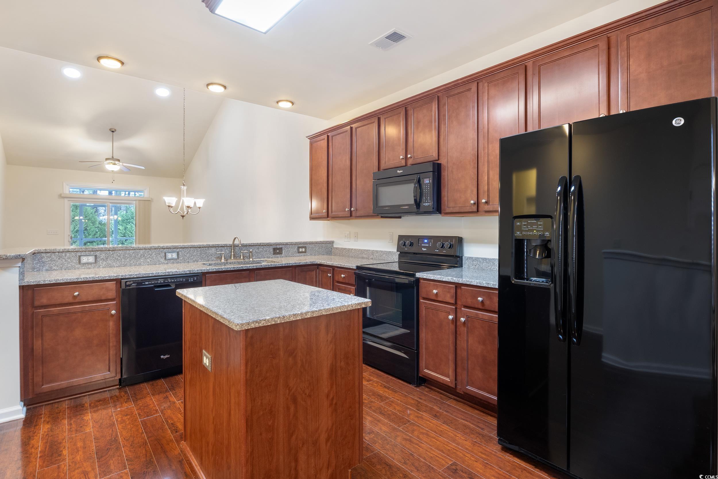 1517 Palmina Loop, Unit B Myrtle Beach, SC 29588 - Photo 13 of 30 Kitchen with dark wood finished floors, a kitchen