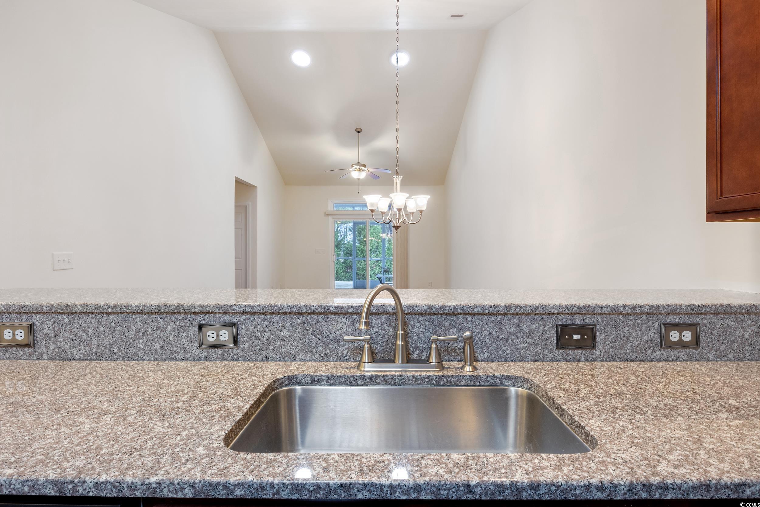 1517 Palmina Loop, Unit B Myrtle Beach, SC 29588 - Photo 16 of 30 Kitchen featuring stone countertops, vaulted ceili