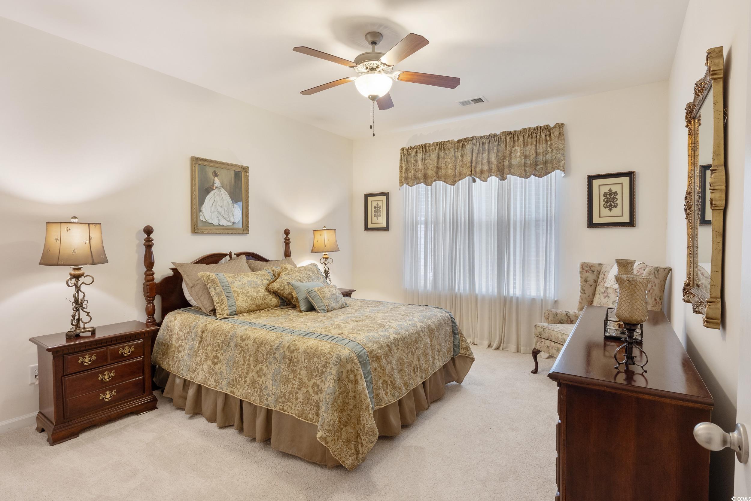 1517 Palmina Loop, Unit B Myrtle Beach, SC 29588 - Photo 18 of 30 Master Bedroom featuring a ceiling fan, light carp