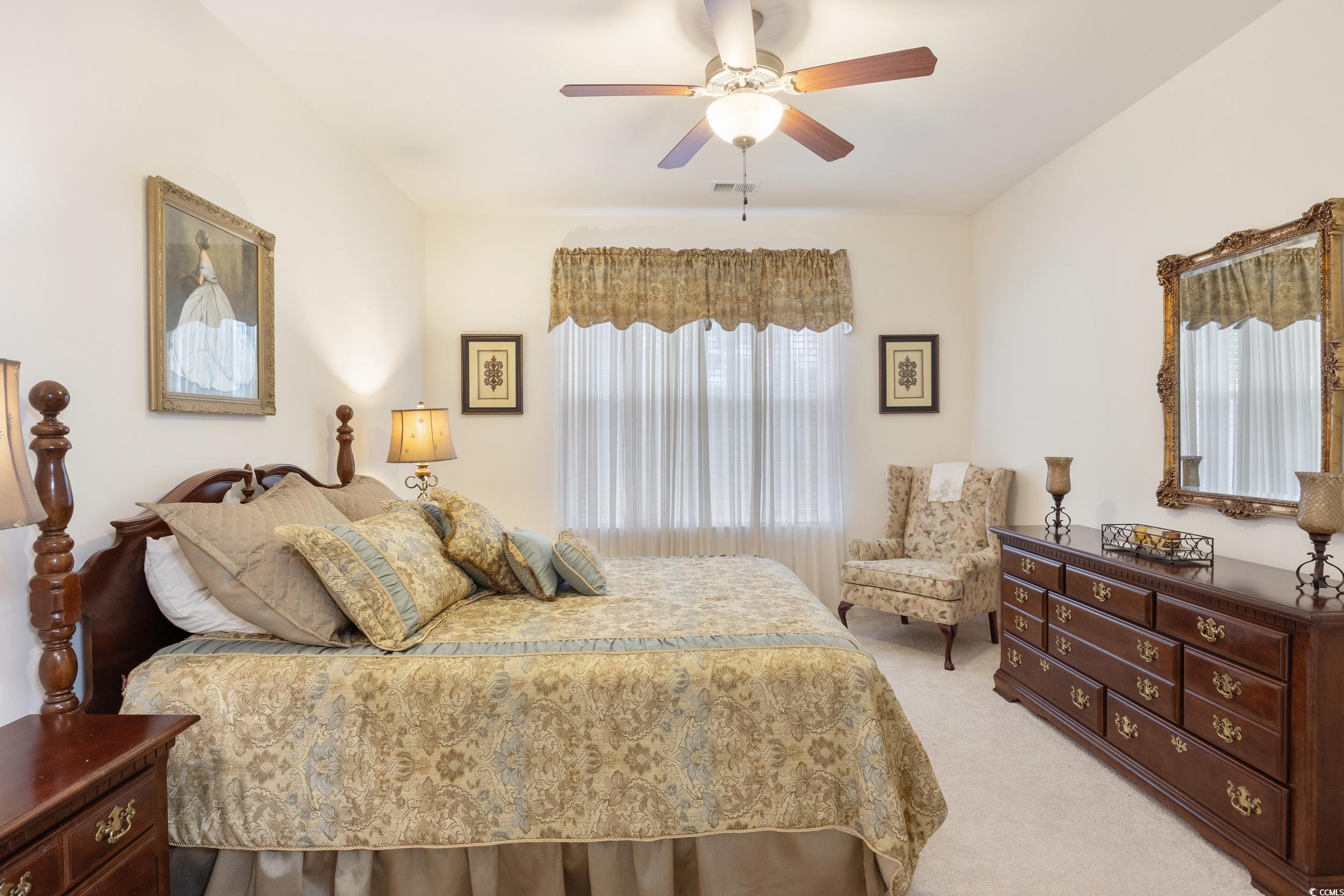 1517 Palmina Loop, Unit B Myrtle Beach, SC 29588 - Photo 19 of 30 Master Bedroom featuring a ceiling fan and light c