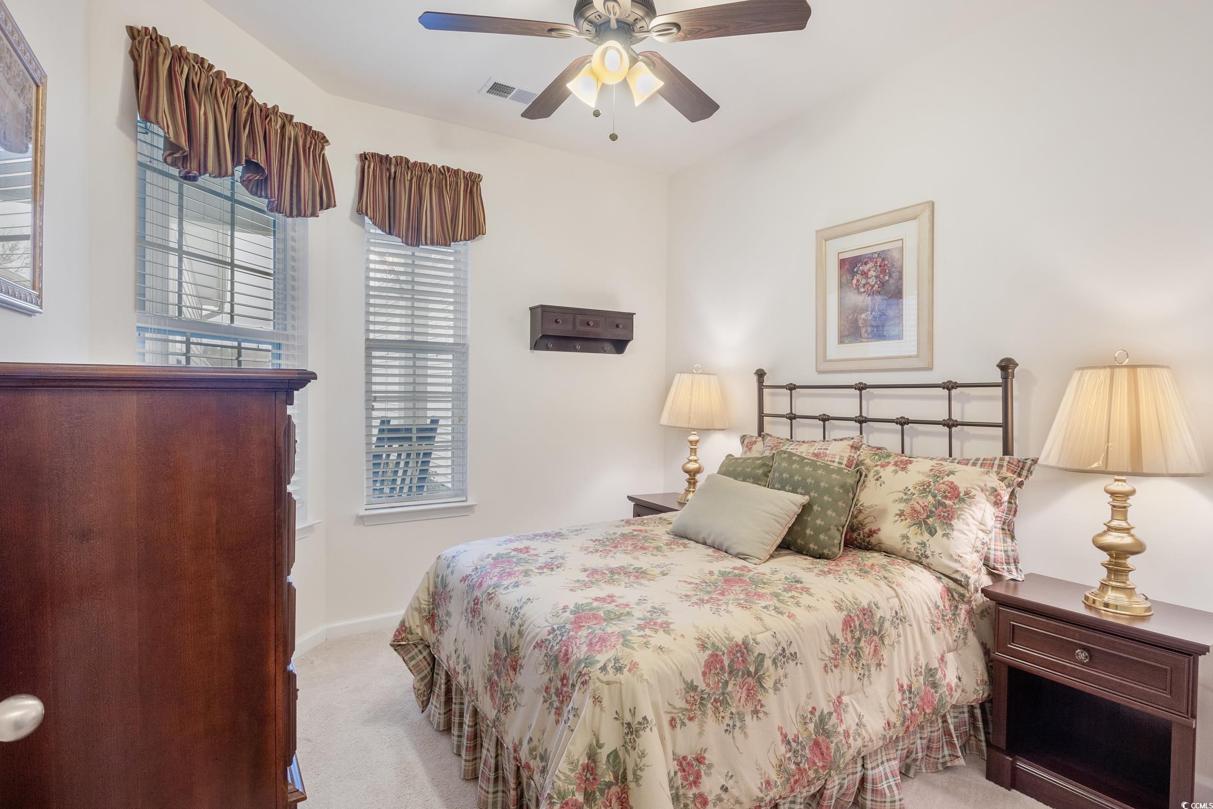 1517 Palmina Loop, Unit B Myrtle Beach, SC 29588 - Photo 20 of 30 Bedroom with light colored carpet, ceiling fan