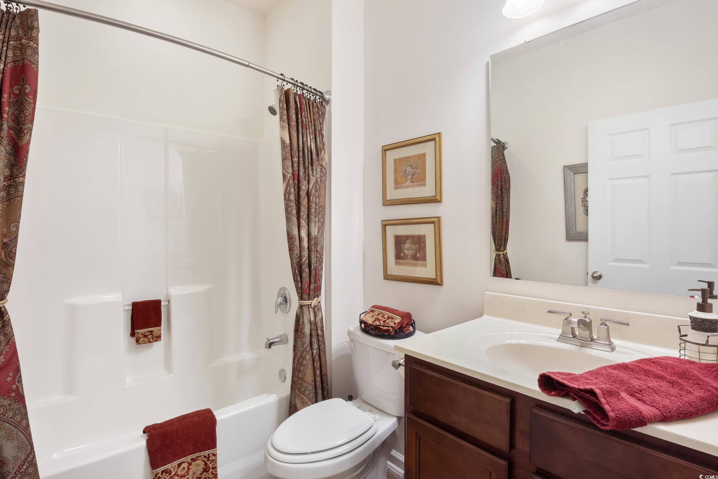 1517 Palmina Loop, Unit B Myrtle Beach, SC 29588 - Photo 21 of 30 Bathroom with toilet, vanity, and shower / tub com