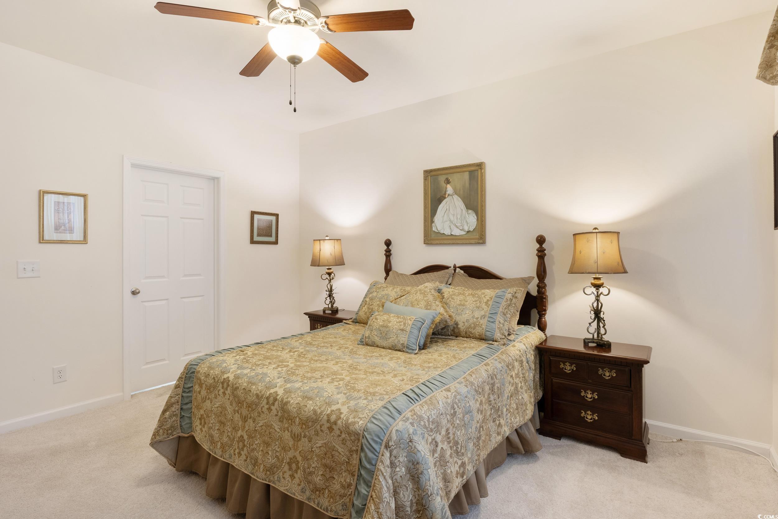 1517 Palmina Loop, Unit B Myrtle Beach, SC 29588 - Photo 23 of 30 Bedroom featuring baseboards, a ceiling fan, and l