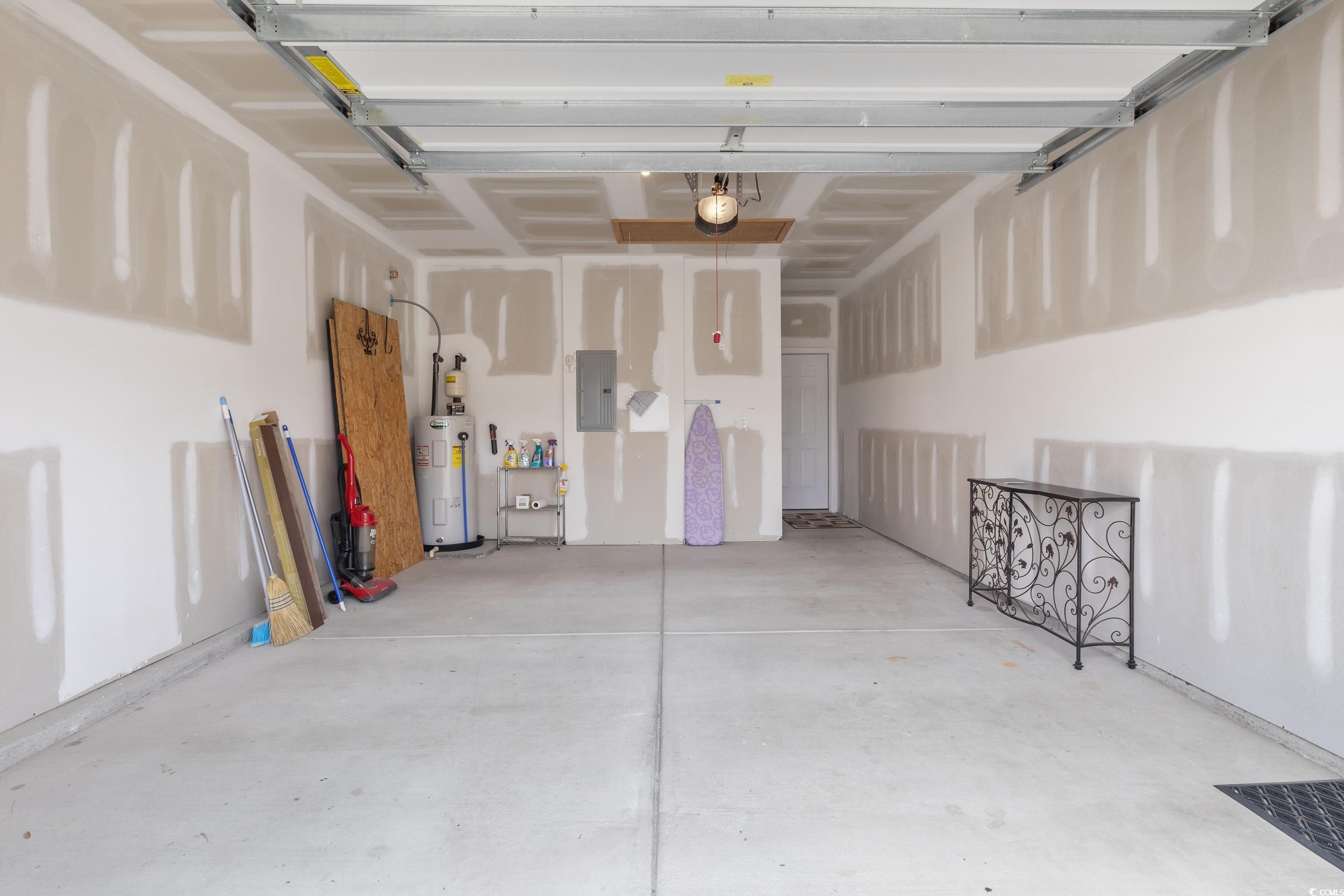 1517 Palmina Loop, Unit B Myrtle Beach, SC 29588 - Photo 27 of 30 Garage featuring electric panel, water heater, a g