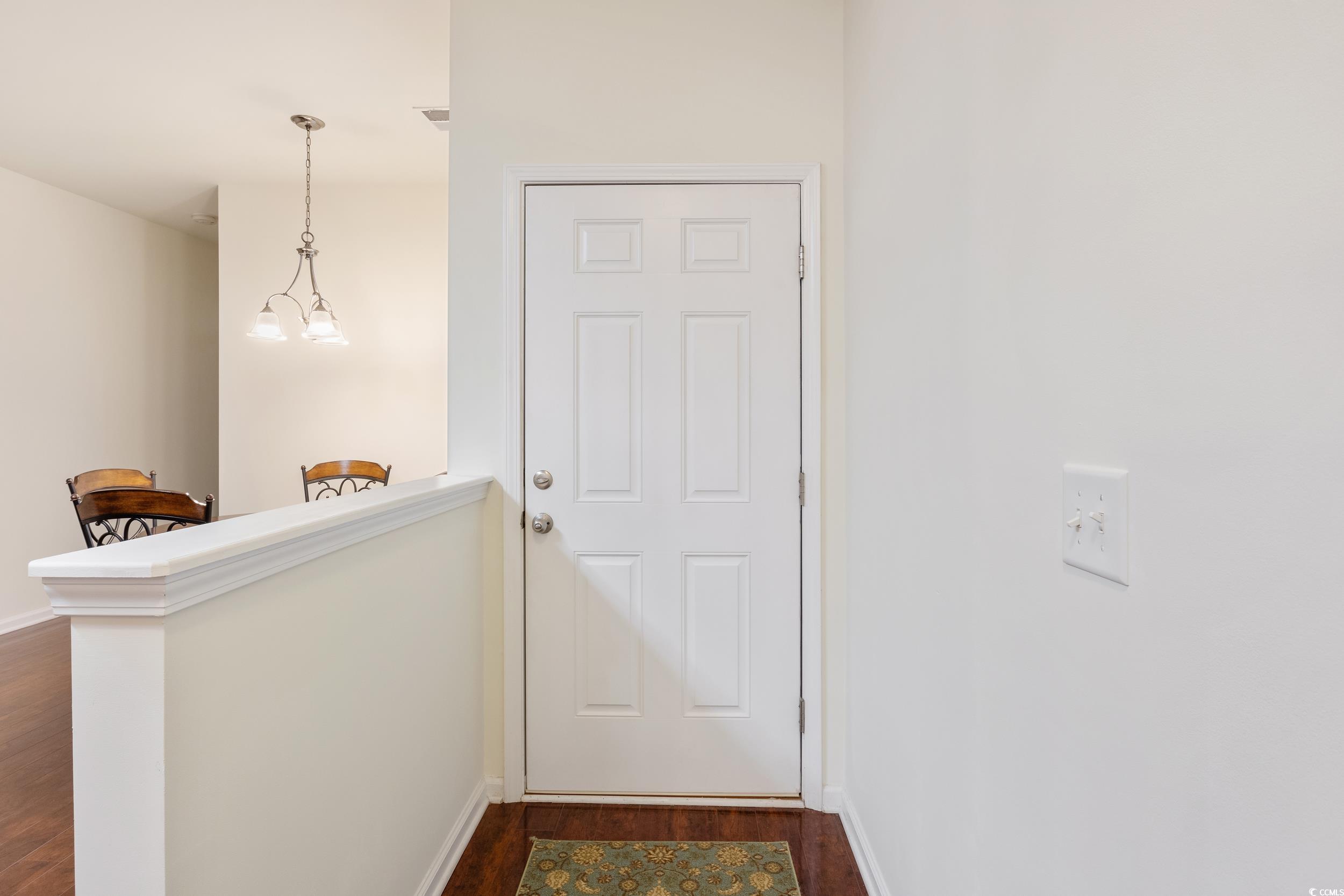 1517 Palmina Loop, Unit B Myrtle Beach, SC 29588 - Photo 6 of 30 Doorway to outside with dark wood-style floors