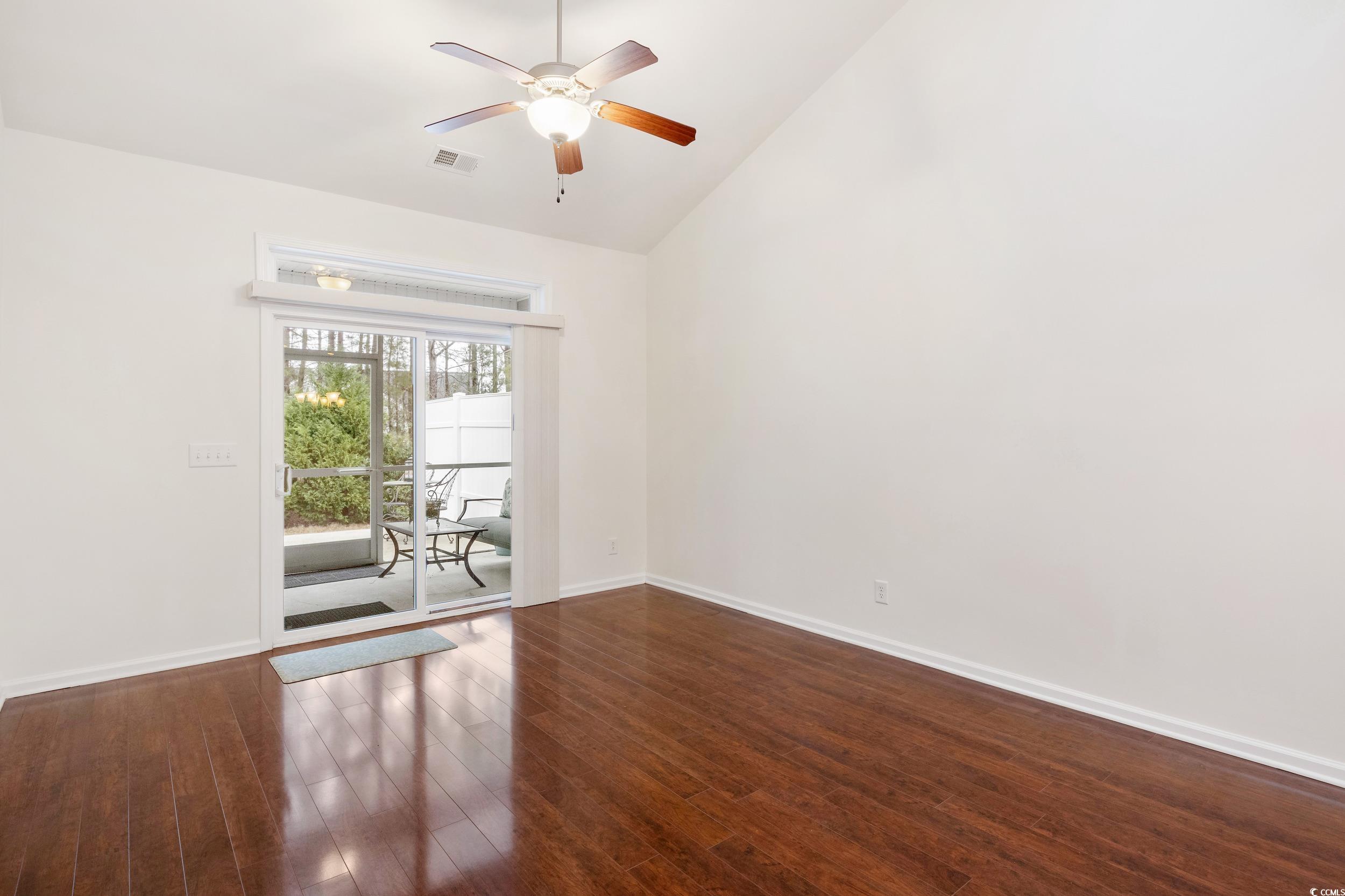 1517 Palmina Loop, Unit B Myrtle Beach, SC 29588 - Photo 8 of 30 Great room featuring a ceiling fan, dark wood-styl