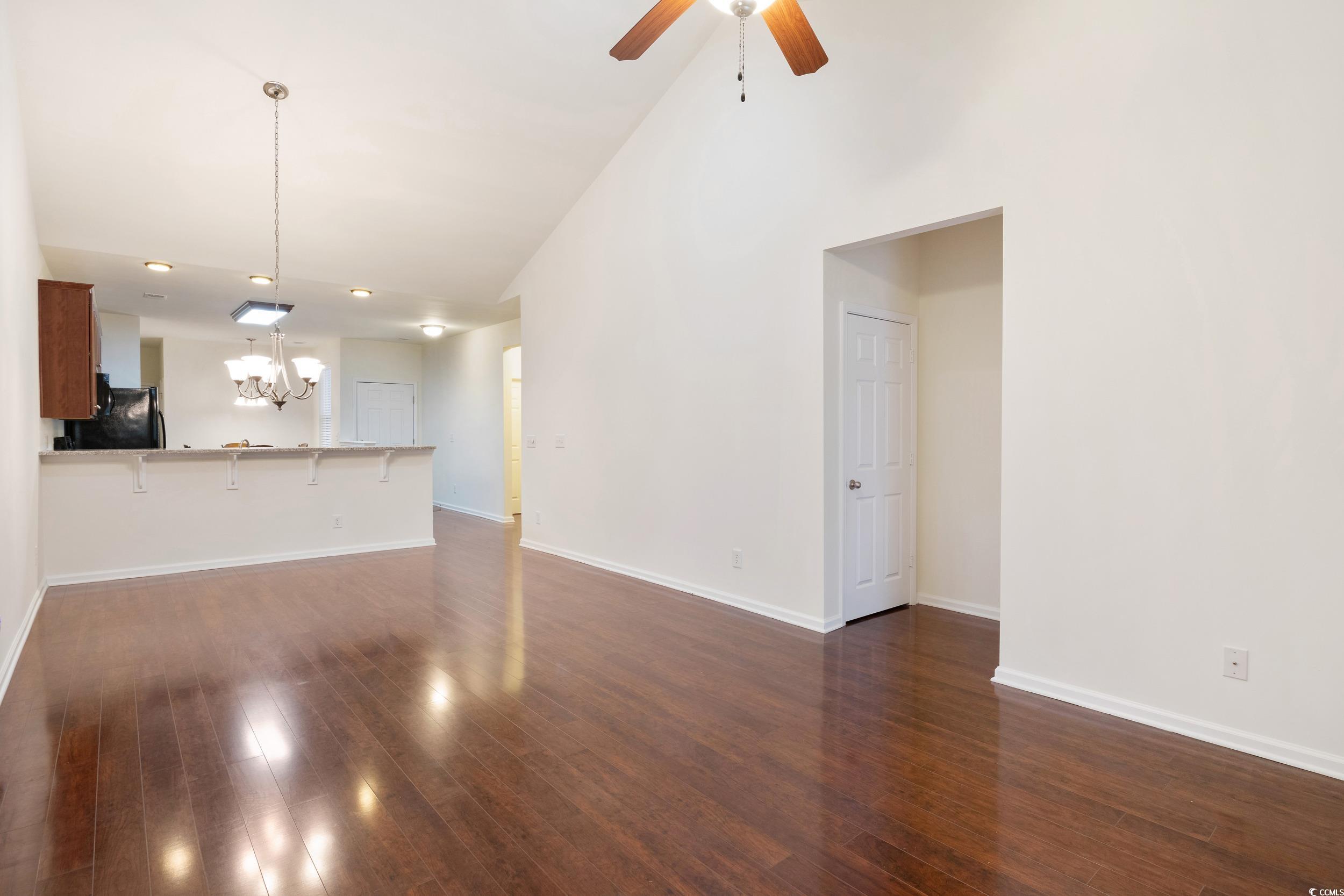 1517 Palmina Loop, Unit B Myrtle Beach, SC 29588 - Photo 9 of 30 living room featuring high vaulted ceiling, dark w