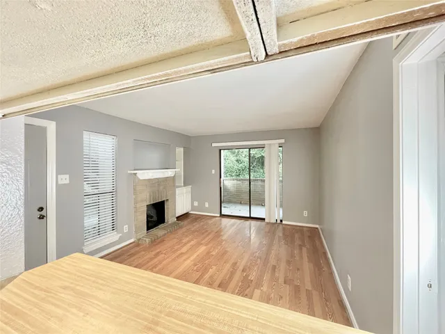 a bedroom with a bed and a fireplace