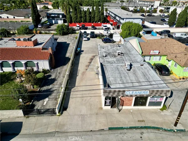 an aerial view of a houses with yard