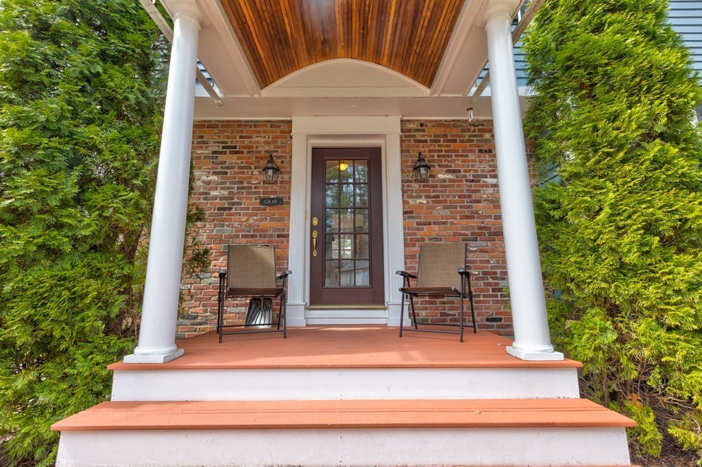 9 Picardy Lane Dover, MA 02030 - Photo 2 of 14 front view of a brick house with a small yard