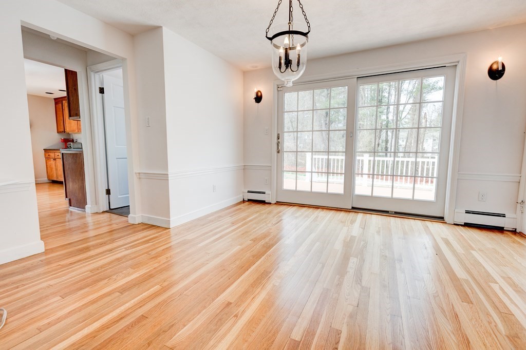 9 Picardy Lane Dover, MA 02030 - Photo 5 of 14 a view of empty room with wooden floor and fan