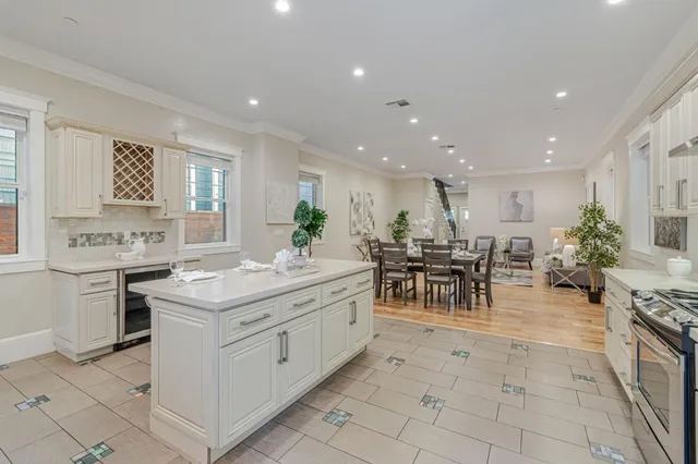 a kitchen with a stove a sink and a refrigerator