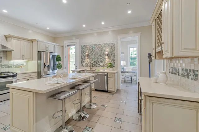 a kitchen with sink cabinets and window