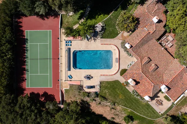 a view of an outdoor space and tennis court