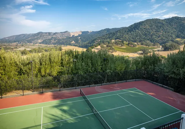 a view of a house with a yard porch and sitting area
