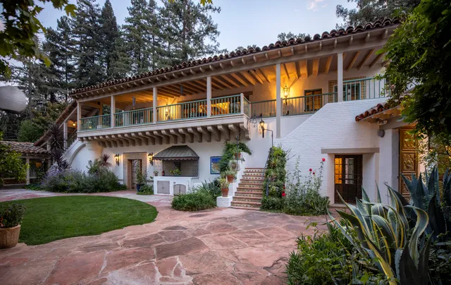 a view of that has couches and a potted plant