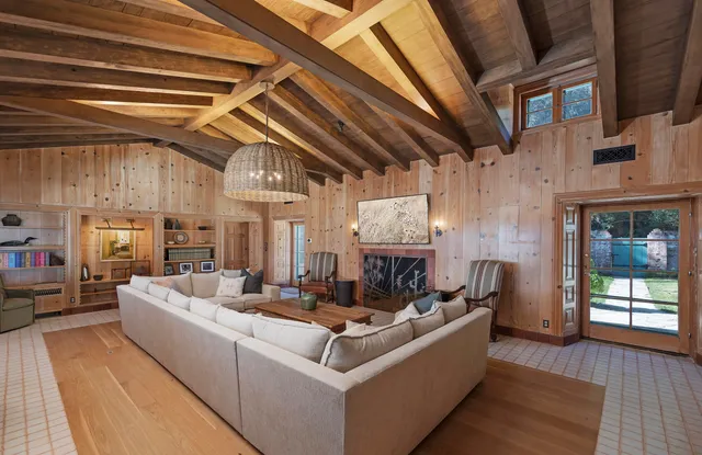 a view of a room with furniture and window