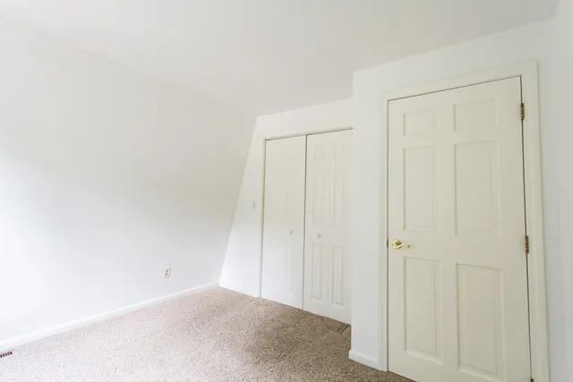 a view of a patio with chairs and a table
