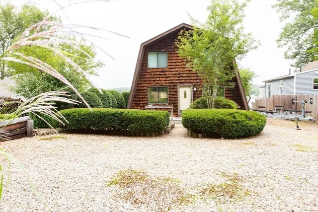 a aerial view of a house with swimming pool and garden
