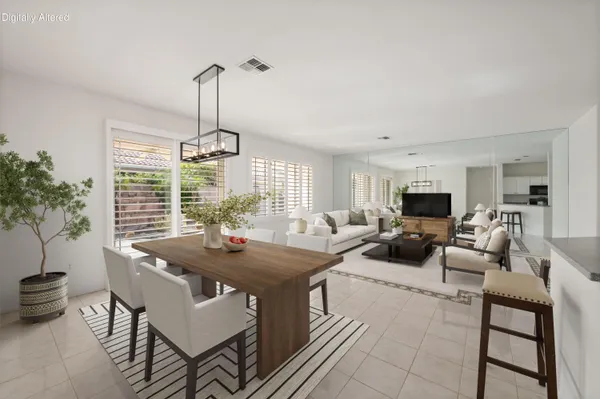 a view of a dining room with furniture window and outside view