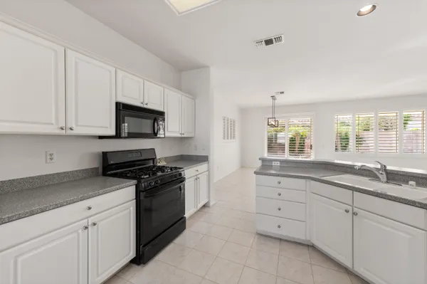 a bedroom with bed and a flat screen tv