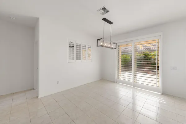 a bathroom with double sink and a mirror