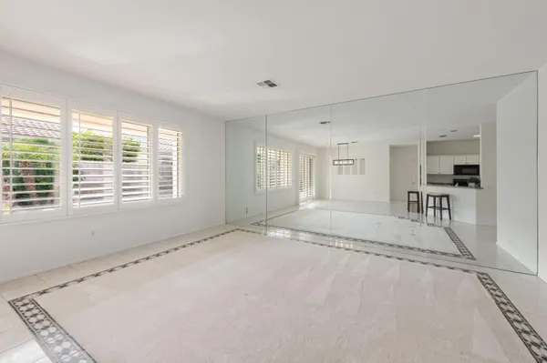 a bathroom with a shower and a glass door