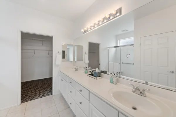 a view of a patio with table and chairs and potted plants