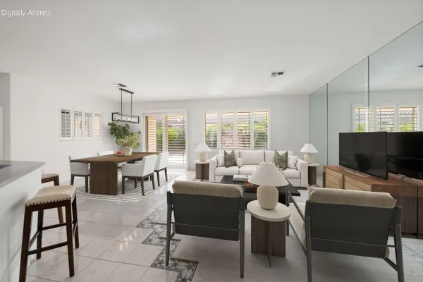 a kitchen with stainless steel appliances granite countertop a refrigerator and microwave