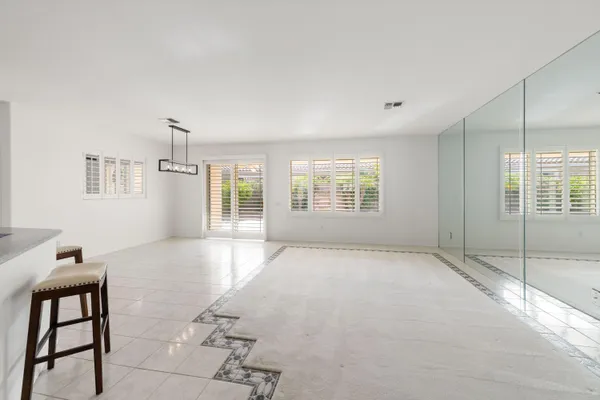 a dining room with furniture and window