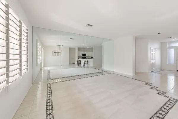 a kitchen with a refrigerator and window
