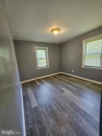 a bathroom with a sink toilet and mirror