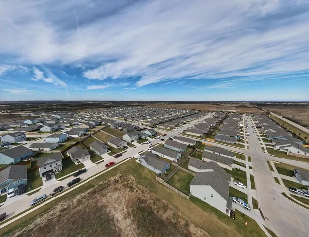 a living room with furniture a lamp and a window
