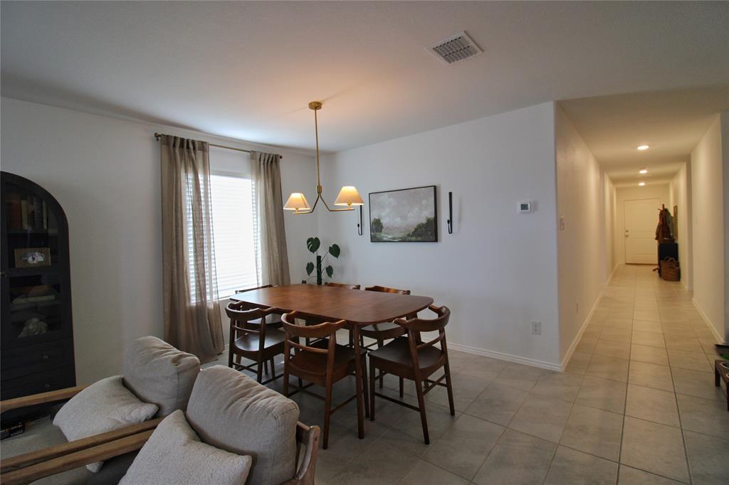 11740 Marcellus Way Rhome, TX 76078 - Photo 13 of 33 a view of a dining room with furniture and window