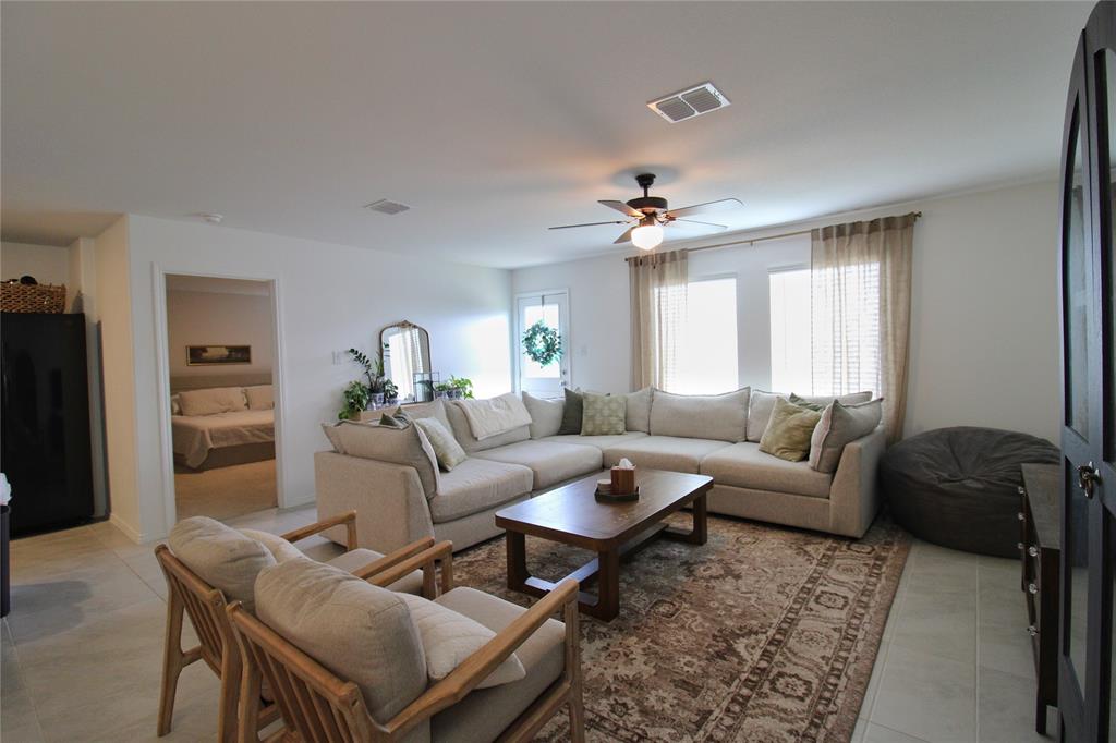 11740 Marcellus Way Rhome, TX 76078 - Photo 14 of 33 a living room with furniture and a window