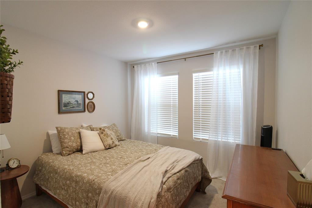 11740 Marcellus Way Rhome, TX 76078 - Photo 16 of 33 a bedroom with a bed and a window