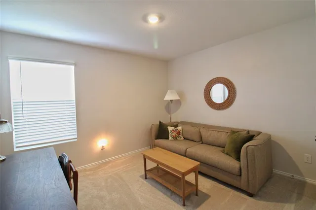 a room with furniture and a flat screen tv