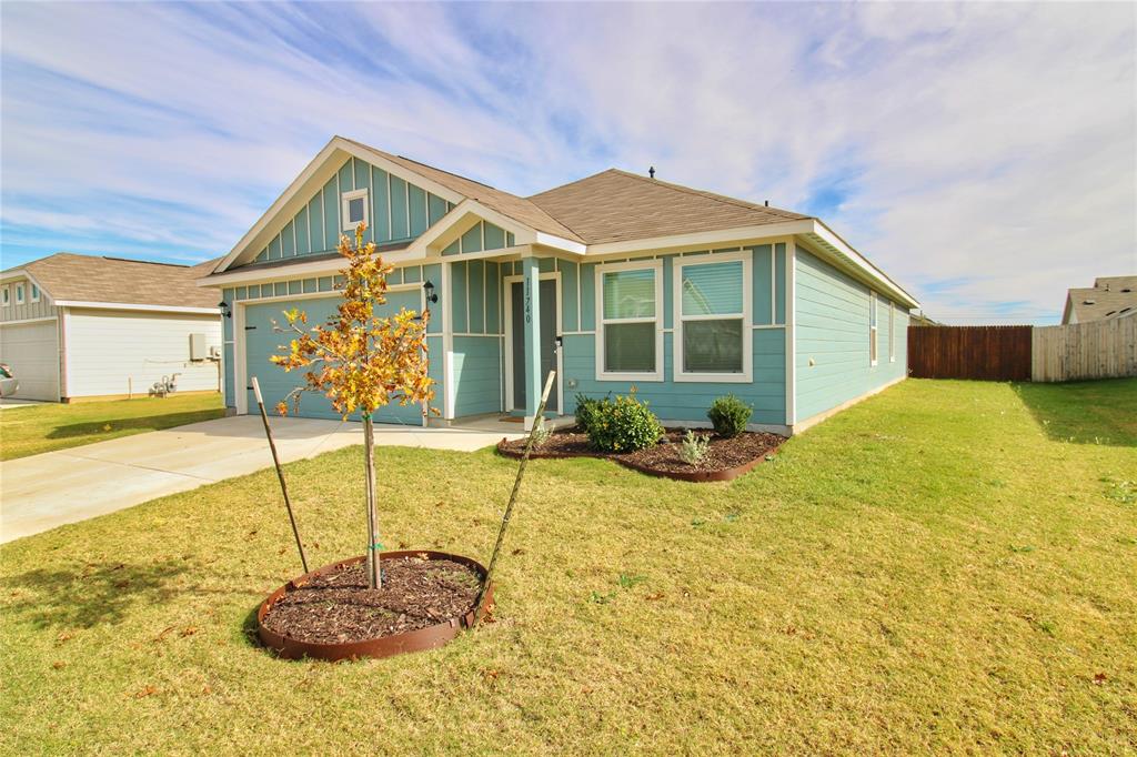11740 Marcellus Way Rhome, TX 76078 - Photo 2 of 33 a front view of a house with swimming pool