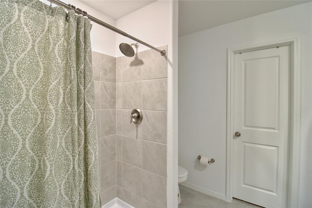 11740 Marcellus Way Rhome, TX 76078 - Photo 23 of 33 a bathroom with a shower