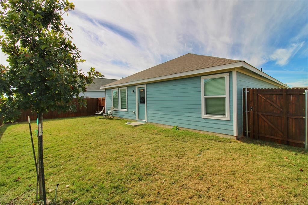 11740 Marcellus Way Rhome, TX 76078 - Photo 28 of 33 a house with yard in front of it