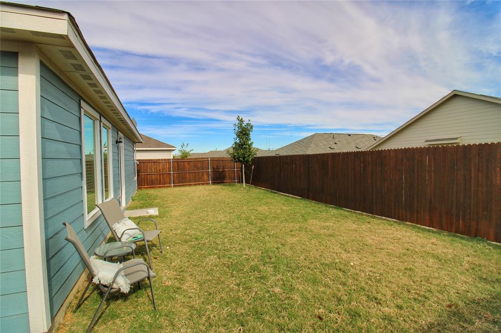 11740 Marcellus Way Rhome, TX 76078 - Photo 31 of 33 a view of backyard with seating area