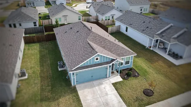 an aerial view of a house with swimming pool