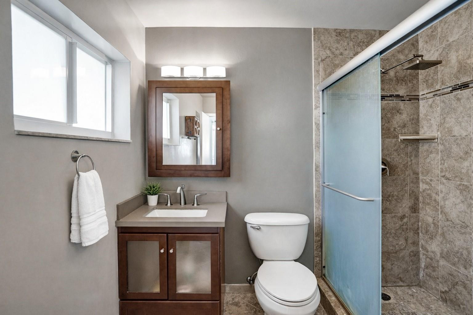 1571 Riverland Road Fort Lauderdale, FL 33312 - Photo 11 of 25 a bathroom with a toilet sink and mirror