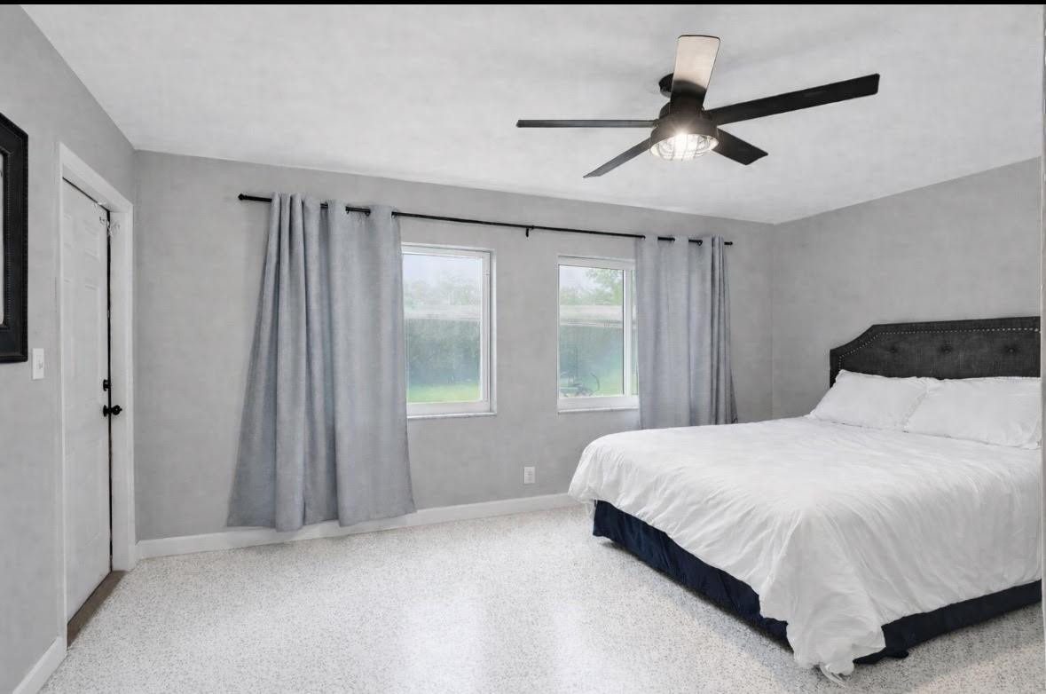 1571 Riverland Road Fort Lauderdale, FL 33312 - Photo 13 of 25 a bedroom with a bed and a window