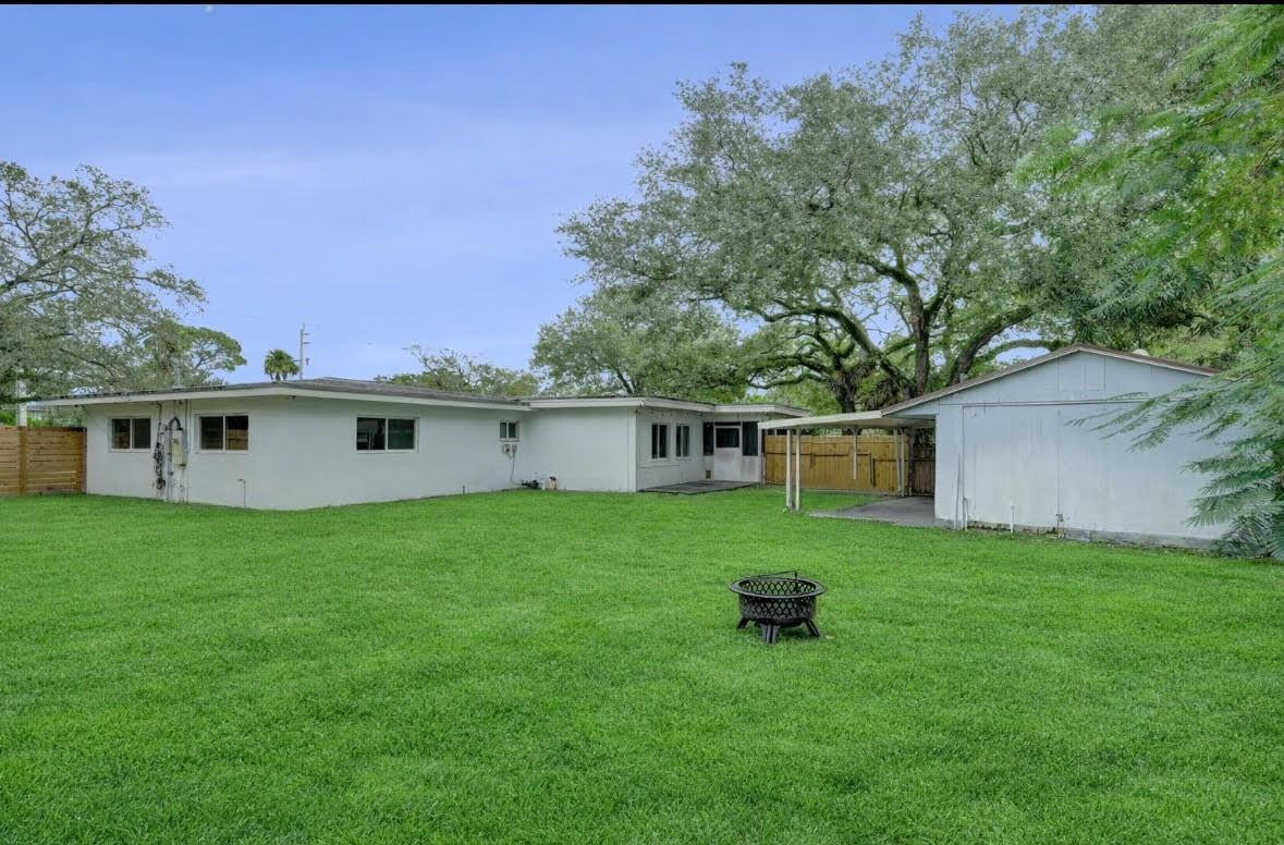 1571 Riverland Road Fort Lauderdale, FL 33312 - Photo 21 of 25 a house view with a garden space