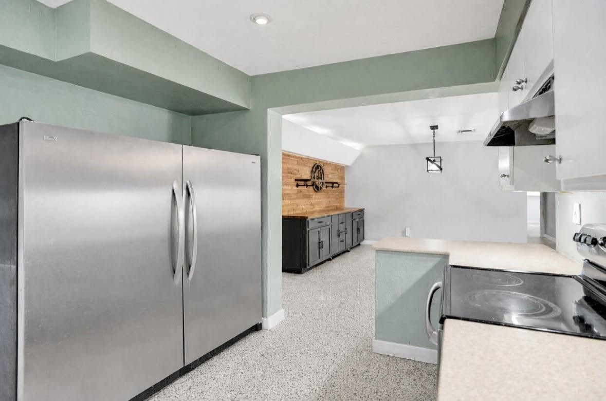 1571 Riverland Road Fort Lauderdale, FL 33312 - Photo 7 of 25 a kitchen with stainless steel appliances granite countertop a refrigerator and a sink
