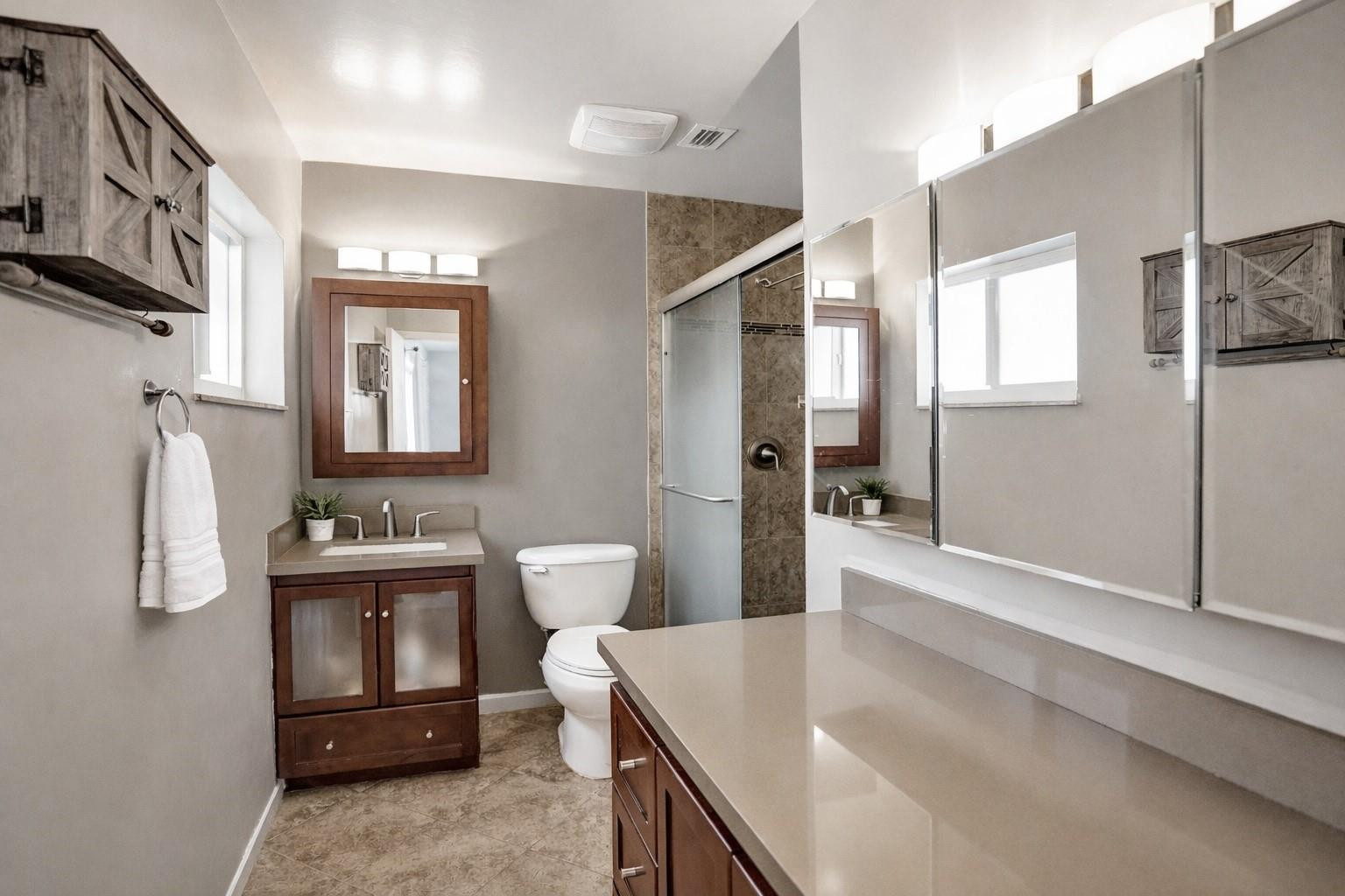 1571 Riverland Road Fort Lauderdale, FL 33312 - Photo 10 of 25 a spacious bathroom with a sink a toilet and shower