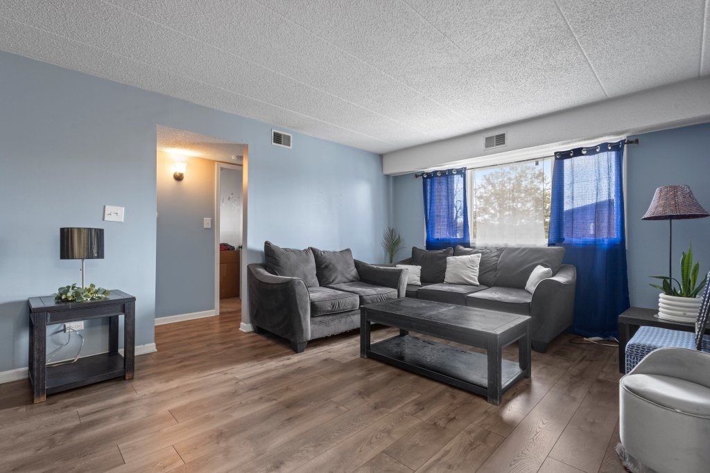 10531 South Roberts Road, Unit 2D Palos Hills, IL 60465 - Photo 2 of 13 a living room with furniture and a large window